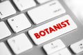 Botanist - plant scientist or phytologist is a scientist who specialises in this field, text concept button on keyboard Royalty Free Stock Photo