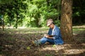 Botanists research sitting under trees are recording the changes nature in the forest Royalty Free Stock Photo