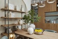 A botany plant into a pot full of a lemon disks on the dining table