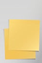 Both of blank syicky notes paper square shape superimposed stick on cement wall