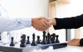 Both businessmen played chess to increase their business skills and held hands together for success