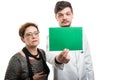 Both male doctor and female patient looking to green board Royalty Free Stock Photo