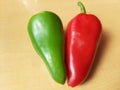 Both red and green chillies lie on the table.Lal aur hari mirch