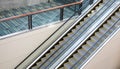 A set of up and down escalators in a public area.