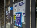 Bothell, WA USA - circa April 2021: Angled view of Covid 19 warning signs on doors at the University of Washington Bothell campus