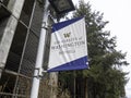 Bothell, WA USA - circa April 2021: Low angle view of a University of Washington Bothell banner on a pole outside the parking