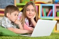 Bother and sister using laptop Royalty Free Stock Photo