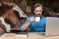 Bothered businessman drinking his coffee and reading Royalty Free Stock Photo