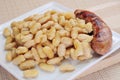 Botifarra amb mongetes, fried white beans and sausage typical of