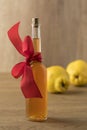 Botlle with homemade quince liqeur as a gift