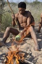 Botswana: Young Naro-Bushmen near Ghanzi making a bush fire Royalty Free Stock Photo