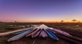Botswanian local mokoro boats in the sunset time, on the shore of delta Okavango river, Botswana Royalty Free Stock Photo