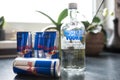 Bottle of Absolut Vodka and cans of Red Bull energy drink on kitchen counter