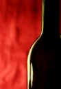 Bottle against a red background Royalty Free Stock Photo