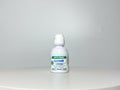 A bottle of Alcon Optifree Contact Solution on a white background