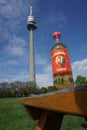 A bottle of Almdudler with the Danube Tower, Vienna, in the background