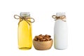 Bottle of almond milk and oil with Peeled almonds in wooden bowl Royalty Free Stock Photo