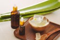 Bottle of aloe vera essential oil with peeled aloe and leaves - beauty treatment Royalty Free Stock Photo
