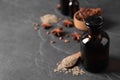 Bottle of anise essential oil and seeds on black table. Space for text Royalty Free Stock Photo