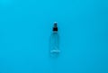 Bottle of antiseptic, a bottle of hand sanitizer, hand sanitizer spray on a blue background, for the prevention of
