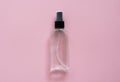 Bottle of antiseptic, a bottle of hand sanitizer, hand sanitizer spray on a pink background, for the prevention of