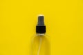 Bottle of antiseptic, a bottle of hand sanitizer, hand sanitizer spray on a yellow background, for the prevention of