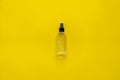 Bottle of antiseptic, a bottle of hand sanitizer, hand sanitizer spray on a yellow background, for the prevention of
