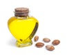 Bottle with argan oil. Cosmetic means. Food product. Isolated background.