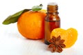 Bottle of aromatic essence and fresh orange Royalty Free Stock Photo