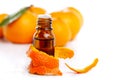 Bottle of aromatic essence and orange Royalty Free Stock Photo