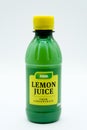 Bottle of Asda Branded lemon Juice in a recyclable Plastic Bottle and Cap