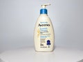 A bottle of Aveeno Eczema Therapy daily moisturizing cream on a white background