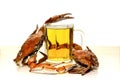 A bottle of beer and boiled crabs on a table
