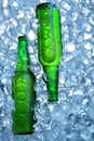 Bottle of beer in ice cubes.Closeup.Green bottle.Hot Summer fresh drink.Copy space Royalty Free Stock Photo