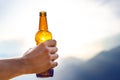 Bottle of beer. Natural background. Man handÃÂ´s keep a bottle of beer. Alcohol drink. Royalty Free Stock Photo