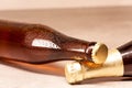 A bottle of blonde beer and a bottle of amber beer lying down Royalty Free Stock Photo