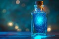 A bottle of blue liquid with a blue glow inside Royalty Free Stock Photo
