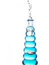 Bottle with blue water pouring out Royalty Free Stock Photo