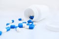 Bottle of blue and white pills. Medicine. Medication Royalty Free Stock Photo