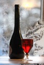Bottle bottle of red wine on wintry background Royalty Free Stock Photo