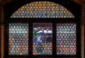 Bottle bottom stained glass window in a half timbered house, Strasbourg, France Royalty Free Stock Photo