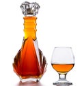 Bottle of brandy and a glass on a table Royalty Free Stock Photo