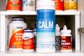 Bottle of Calm Magnesium Supplement by Natural Vitality on shelf of kitchen cupboard