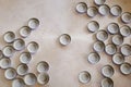 Bottle caps lies on white texture. beer caps