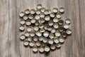 Bottle caps lies on wood texture Royalty Free Stock Photo