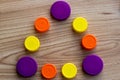 Bottle caps - triangle of multicolored PET plastic caps Royalty Free Stock Photo