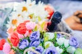 Bottle of champagne and bouquet of flowers of roses Royalty Free Stock Photo