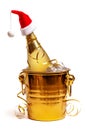 A bottle of champagne in a bucket of ice, decorated with a New Year\'s serpentine Royalty Free Stock Photo