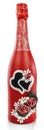 A bottle of champagne decorated with two hearts, beads, fur. Champagne is painted red and decorated