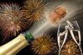Bottle of champagne with flying cork and firework at Silvester 2019 Royalty Free Stock Photo
